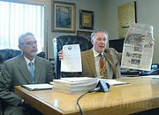 Jerry Robert's attorney Dennis Merenbach holds up the News-Press "front page smear" in 2007