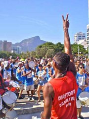 The Diretoria Carnival leads his Bateristas in a Samba drum show with Cristo Redentor towering in the background.