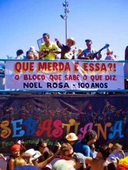 The bloco truck with musicians on top follows the parade's baterista section and is the center of procession.