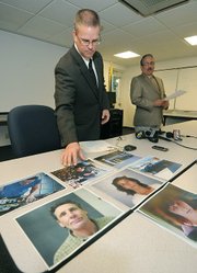 Sgt. Ed Olsen displays mugshot of alleged Gillespie St. shooter Jack Mills and his wife, an alleged accomplice, Rebecca Mills.