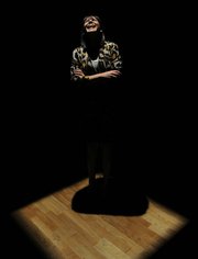 CAF's Executive Director Miki Garcia takes a turn on the stage of Biggers's new, untitled work.