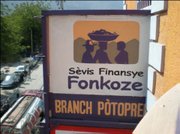 Sign on the newly dedicated Port au Prince branch bank of Fonkoze. The former bank building was destroyed in the earthquake.