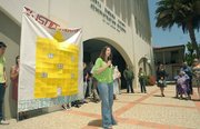 Pueblo executive Director Belen Seara leads a 2009 rally for renters' rights in front of the County Administration Building with Selma Rubin (right) attending