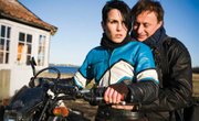 Mikael (Michael Nyqvist) and Lisbeth (Noomi Rapace) trace a long-missing girl in Swedish thriller <em>The Girl with the Dragon Tattoo</em>.
