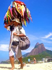 A vendedor of bikinis stalks the beach in Rio, in search of bikini-hungry customers.