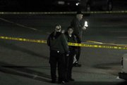 Sheriff's forensic team make a video documentation of crime scene where a man was fatally stabbed Thursday April 15, 2010