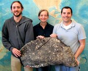 From left, UCSB's Christopher Farwell, Sarah Bagby, and David Valentine with asphalt recovered from underwater volcanoes during a dive on the research submarine Alvin.