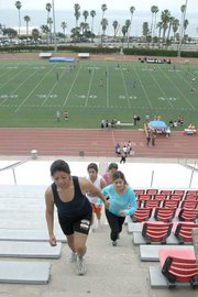 A group of Santa Ynez Valley High Schoolers work out at La Playa Stadium with Queenie Longley