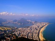 A scenic view point in Rocinha shows the sprawl to the east of Rio's Zona Sul neighborhoods Gávea (on the left), Leblon (between Gávea and the ocean), Ipanema, and Copacabana (farthest back). The hills poking up are home to favelas.
