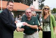 Fidelity Investments Branch Manager and Vice President Kai Bartschi handing a check for $2,500 to MacKenzie Park Lawn Bowls Club President Victor Elsey, with Pamela Polomski, Fidelity Vice President and Senior Account Executive looking on. In the back are MPLBC officers Joe Odgers and Shirley Russell.