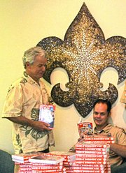 Local author Dana E. Fisher, left, donated more than 100 copies of his book, "Santa Barbara Fun, for Ages 1 to 100"