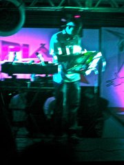 At the Emoções baile in Rocinha, the featured funk DJ of the weekend works the crowd.
