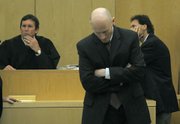 Hans Almgren leaves a sidebar with Judge Brian Hill and the defendants' attorneys on July 6, 2010 with a mistrial looming on three of the five counts.