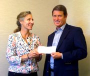 Dr. Alice Scharper, Santa Barbara City College Dean of Educational Programs; accepts a $5,000 grant check from David A. Prichard, US Trust/Bank of America Senior Vice President.