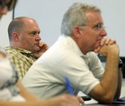 <strong>CAUSE AND EFFECT:</strong> Detective Jaycee Hunter (left) and Sgt. Charles McChesney contend that crime has increased during the past 10 years as the department has reduced the number of authorized officers from 152 to 137 in response to chronic budget shortfalls, which, they maintain, were intentionally engineered by City Administrator Jim Armstrong to justify shrinking the department.
