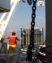 Natural gas collected with a containment cap at the sea floor is flared at the surface by the Discoverer Enterprise. The amount of gas being flared represents about 15 percent of the gas emitted to the deep ocean.