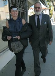 The Quaids, Evi with a credit card stuck to her forehead and Randy with a toy sheriff badge, after leaving the courthouse for their arraignment last year.