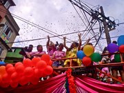 People atop a giant truck of speakers blasting music enliven the crowd to the tune of Gloria Gaynor, Lady Gaga and the like.