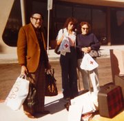Ralph Morris, Joyce Axilrod, and Ruth Morris with bags from the American Red Cross after the fire.