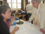Gabriela Rodriquez of Future Leaders of America discusses Assembly Bill 540 with longtime league member Betty Newcomb during Wednesday's forum.