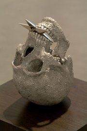 This bronze sculpture of an inverted skull with a metal star in its mouth is a portrait titled “Ahab” (2008) from Tony de los Reyes’s exhibition <em>Chasing Moby-Dick</em> at the S.B. Museum of Art.