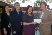 Irene Macias, Santa Barbara Public Library System director; Beverly Schwartzberg, Santa Barbara Public Library Literacy Coordinator; Michele Allyn, Friends of the Santa Barbara Public Library president; and Holly Cole, director, Government & External Affairs, Santa Barbara and Ventura Counties, Verizon