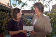 Michele Allyn, Friends of the Santa Barbara Public Library president, and Holly Cole, director, Government & External Affairs, Verizon