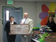 Veronica Sandoval, Administrator for the Santa Ynez Band of Chumash Indians, Erik Talkin, Executive Director for the Foodbank, along with a Produce Initiative Volunteer.