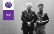 Werner accepts his award at the IDKTechEx “Future of Electric Cars” conference in Silicon Valley