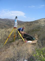 Bodo Bookhagen working with a lidar device that his group uses for detecting changes in the landscape, including on snow fields and glaciers.