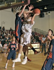 Westmont’s Dan Rasp (#42) went for the basket in the Warriors’ game against Fresno Pacific at the GSAC Tournament.