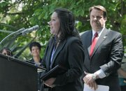 Lompoc Detective Suzie Aanerud (center) says a few words upon receiving the Victim Service Award as Sheriff Bill Brown (right) looks on April 14, 2011