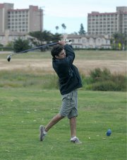 <strong>LAST ROUND?:</strong> Daniel, a senior at UCSB, gets in a quick nine holes at Ocean Meadows Golf Course in Goleta earlier this week. Plans are in the works for the links to soon be sold to the Trust for Public Land and eventually turned back into the Devereux Creek wetland area it once was.