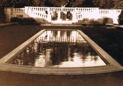 Huguette and Anna E. Clark with other relatives and friends at the reflecting pool on the estate, circa 1935-1940.