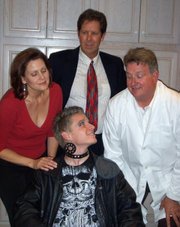 Deborah Bertling, Sean O'Shea, David Couch, and Tyler Gilbert (seated) in Circle Bar B's <em>It Runs in the Family</em>.