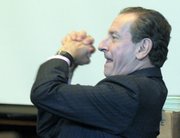 Peter Lance, after being admonished by Judge Brian Hill for giving a thumbs-up to a witness, responds with a more dramatic gesture of approval