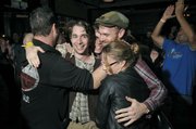 Saint Anne's Place gets hugs from fans after being named the winner in the 2011 Downtown Sound battle of the bands at SOhO