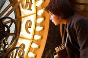 Martin Scorsese enters family-friendly turf with <em>Hugo</em>, a visually impressive if somewhat disjointed ode to silent film starring Asa Butterfield (above) as the clock-tending title character.