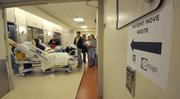Evanalene Benchek is moved from Cottage Hospital's existing wings to the new patient pavilions