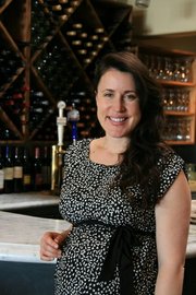Jane Chapman, manager of the restaurant Jane, on State Street, won $10,000 in the first of several drawings.