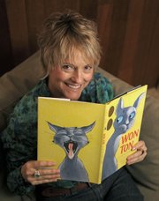 Lee Wardlaw at her home in Santa Barbara with a copy of Won Ton: A Cat Tale Told in Haiku April 6, 2012