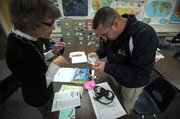 Post and Chaparral Principal Marilyn Smith study a plastic baggie that Skeeter found suspicious.