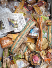 Trader Joe's food items found in Whole Foods trash dumpster. (Copy of daily newspaper included to prove date of discovery.)