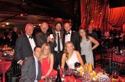 Group shot at Rock and Roll Hall of Fame induction ceremony. Back row from left: Madison Murphy, Terry Stewart (CEO of the Rock Hall), Dieter Cronje (winemaker, Presqu'ile), Matt Murphy (President, Presqu'ile), Anna Murphy; front row from left: Jonathan Murphy (assistant winemaker, Presqu'ile), Lindsey Russell Murphy, Amanda Murphy.