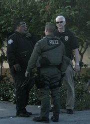 SBPD personnel responds to reports of a woman with a handgun barricaded inside her Milpas Street apartment