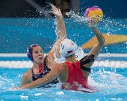 Kami Craig (left), Santa Barbara’s gold medalist at the London Olympics, during the U.S. team's match against China.