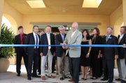 Goleta Mayor Ed Easton mans the scissors during a ribbon-cutting ceremony for the city's new Courtyard by Marriott hotel