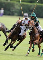 Grant's Farm's Jeff Hall (right) battles with Mansour’s Hilario Ulloa during a recent match.