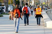 Perry Cabugos (volunteer), Maggie Cote RN (volunteer), Dr. Jason Prystowsky (volunteer) walking on street rounds