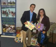 Circle V Ranch Camp & Retreat Center Director Ray Lopez gratefully accepts the donation of 2,112 children’s books along with 453 items of arts & craft supplies from 16-year-old Isabella Virgen, member of the Girl Scouts of Greater Los Angeles Troup 581 from San Marino.